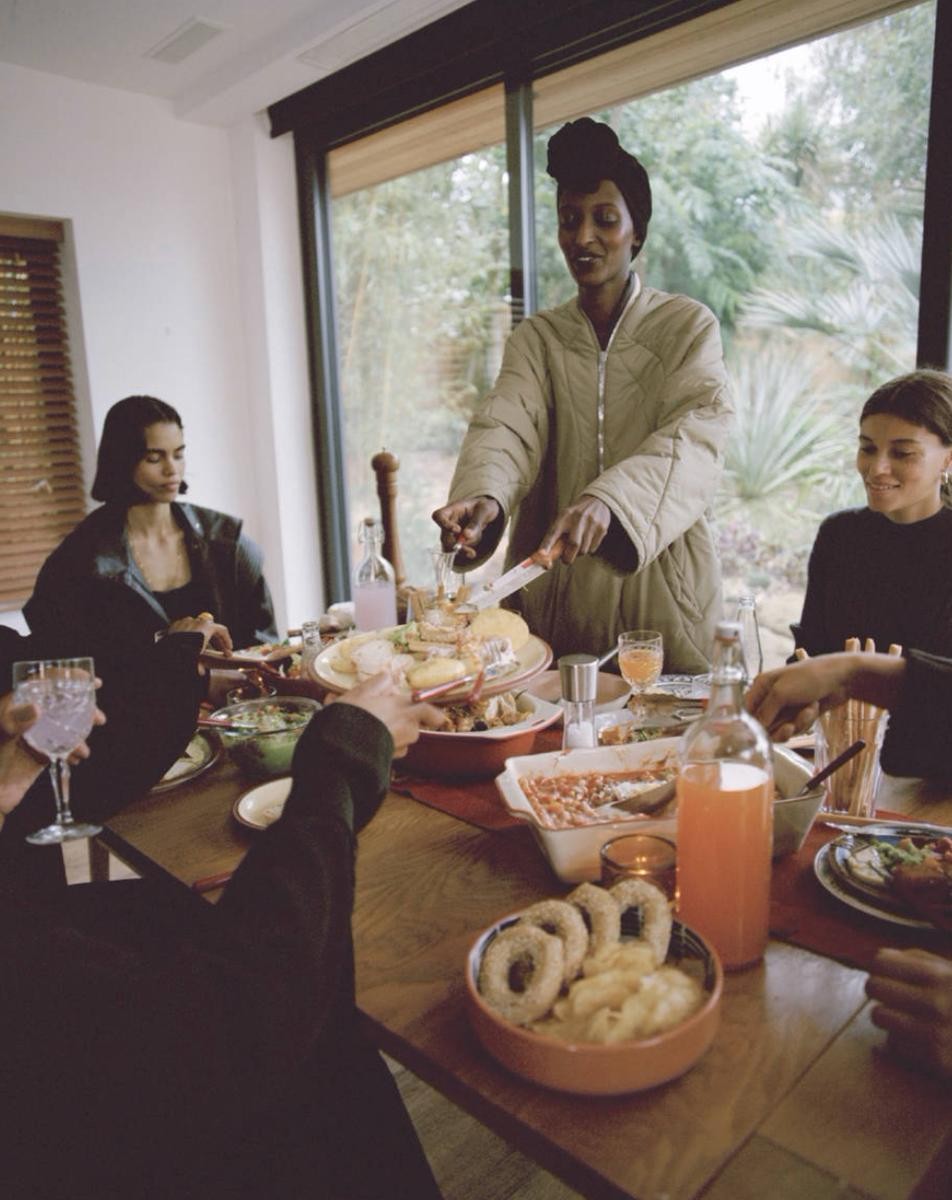 Friends sharing food together around a table