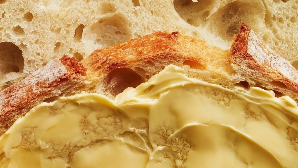 Cultured butter spread on crusty bread