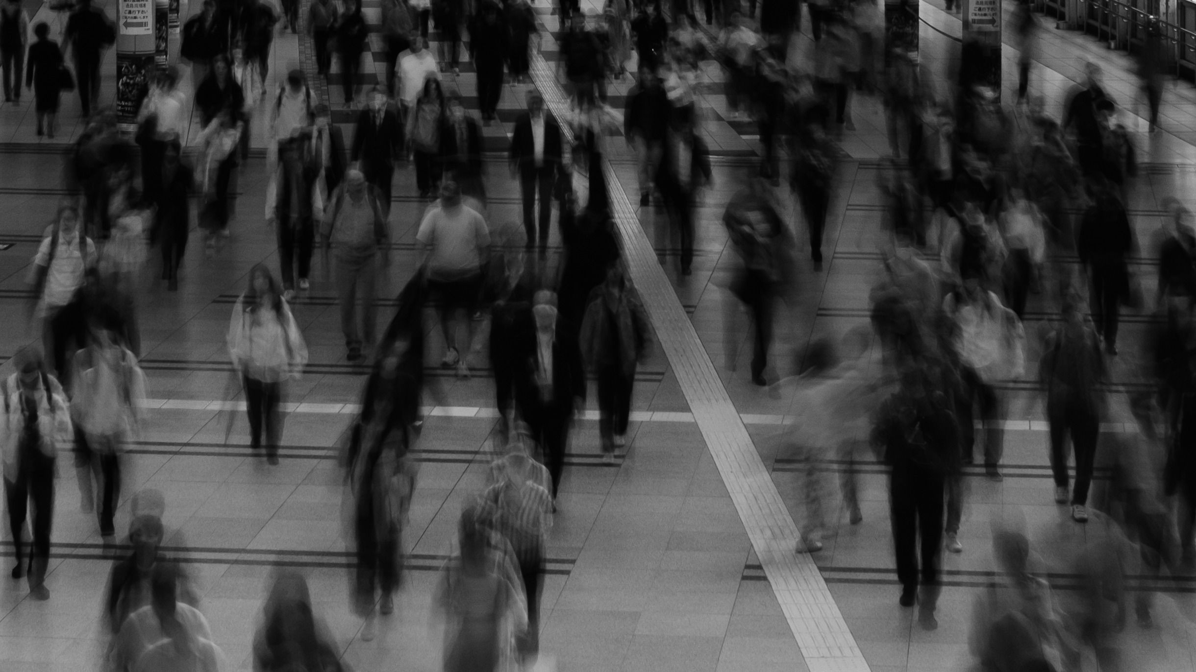People moving through a crowded city